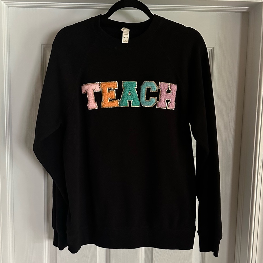 Black Crewneck with Colorful 'TEACH' letter patch